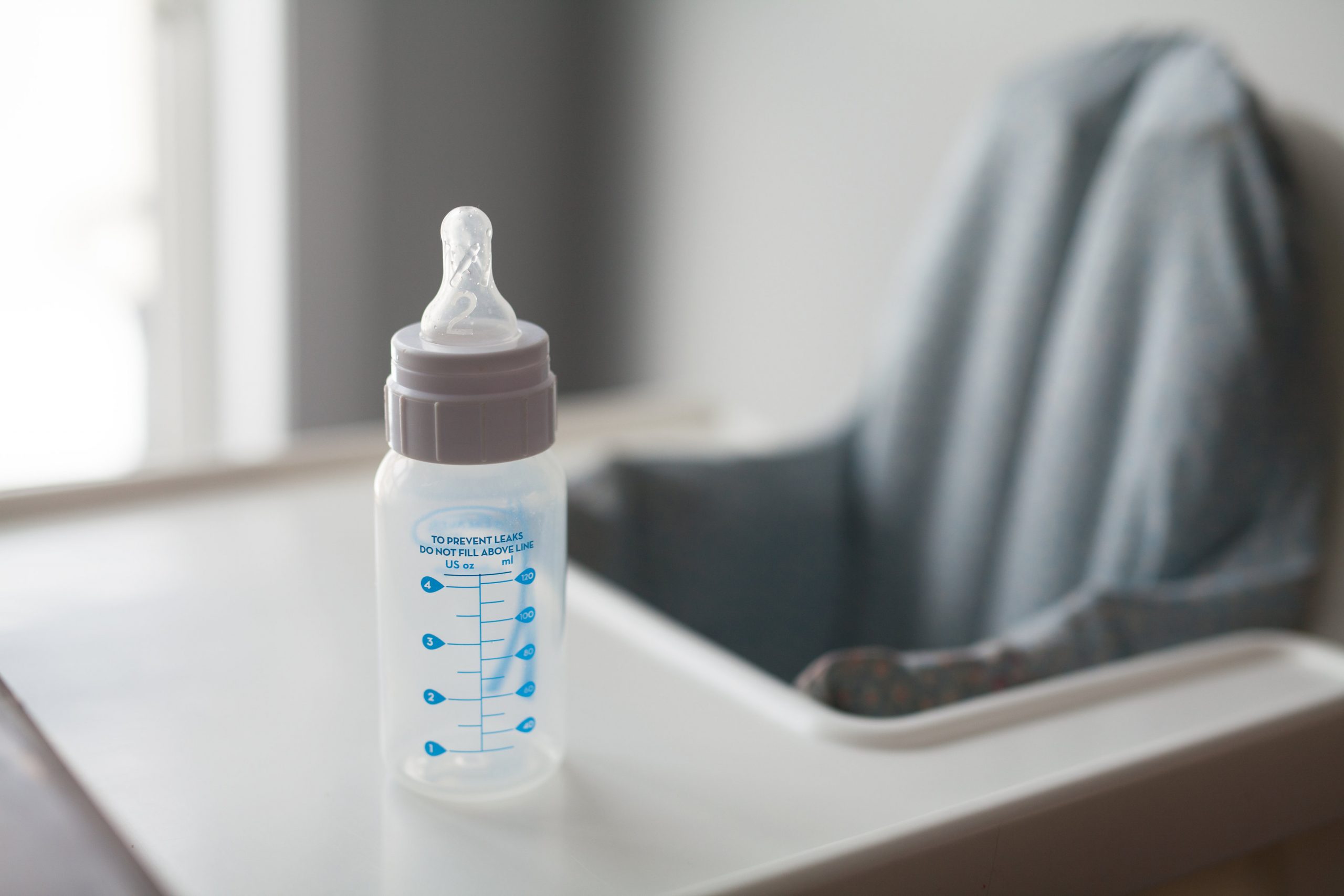 Empty baby milk bottle.